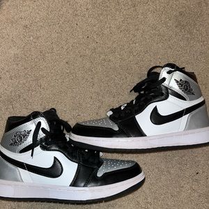 Black and silver high top Jordans